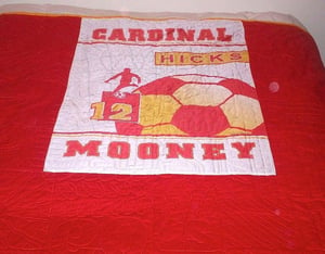 banner on the back of a quilt mooney