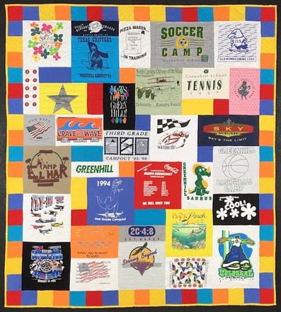 colorful fun summer feel to this T-shirt quilt. the pieced binding made from left over fabric from the T-shirts used in the quilt. T-shirt quilt with a border by Too Cool T-shirt Quilts