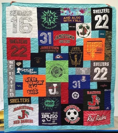 T-shirt quilt with a border by Too Cool T-shirt Quilts