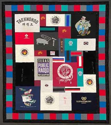 T-shirt quilt with a border by Too Cool T-shirt Quilts