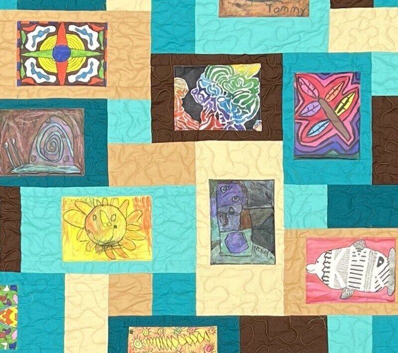 Kids artwork on in a quilt