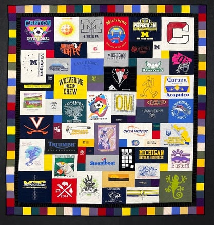 T-shirt quilt with a border by Too Cool T-shirt Quilts