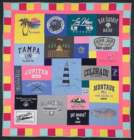 Travel T-shirt quilt  with a cheerful pieced and solid border. T-shirt quilt with a border by Too Cool T-shirt Quilts